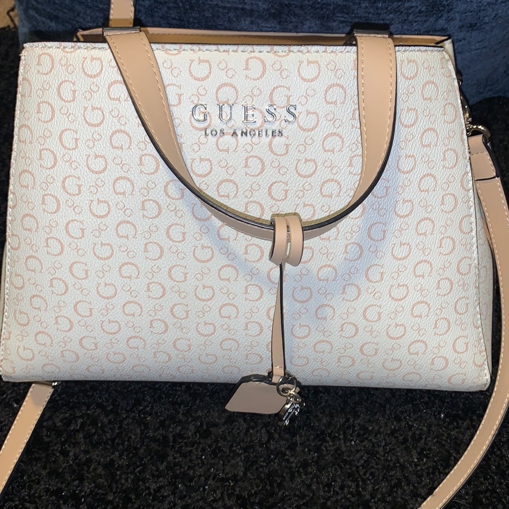 Tan and white guess bag.